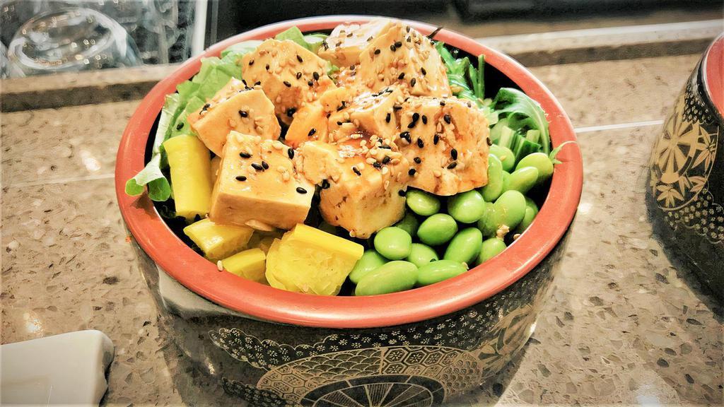 Veggie Poke Bowl · Avocado, cucumber, seaweed salad, edamame, pickled daikon, and sesame seeds.