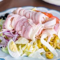 Chef Salad · With turkey, ham, lettuce, tomatoes, onion, black and green olives, egg, provolone and Ameri...