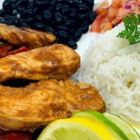 Chicken Fajitas · Baked chicken with onions and peppers. Served over basmati rice with black beans and salsa. ...