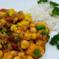 #28. Indian Sweet Potato Curry · Sweet potatoes, cauliflower, lentils, green peas, chickpeas, and tomatoes stewed in mild ind...