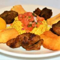 Yuca Con Chicharrón · Cassava root fried or steamed with fried Pork, topped with green cabbage, red onions, and ca...