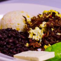 Carne Deshilada Con O Sin Huevo · Shredded beef with or without egg, Salvadorean cheese, avocado, and black beans.