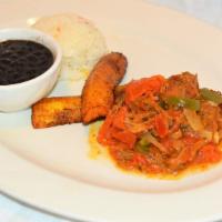 Ropa Vieja · Shredded beef in tomato sauce, fried plantain, and black beans.