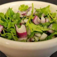 Cilantro Y Cebolla Picado · Chopped cilantro and onions.