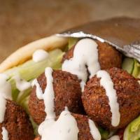 Falafel Gyro · Cooked on a spit and wrapped in a pita.