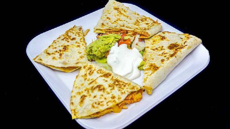 Quesadilla Mexicana  · Flour tortilla with your choice of meat . served with pico de gallo, sour cream, and guacamole.