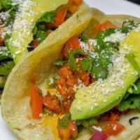 Tacos · Tacos with your choice of meat topped with pico de gallo, cilantro, and sliced avocado.