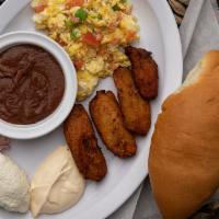 Plato Típico  · Classic Salvadoran breakfast dish, Includes two eggs, refried beans, plantains, Salvadoran s...