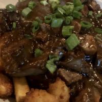 Brack'S Poutine · Fries, cheddar cheese curds, and tender bbq beef brisket, bacon and pulled pork  topped with...
