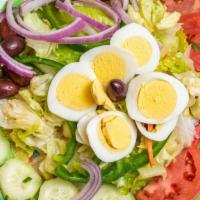 Crisp Garden Salad · Lettuce, tomatoes, peppers, onions, cucumbers, olives, eggs.