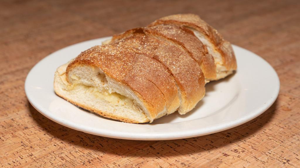 Garlic Bread · Served fresh out of the oven our 1/2 loaf contains 4 slices.