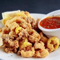 Fried Calamari · Breaded, deep fried and crispy!  Served with banana peppers and our home made marina sauce!