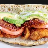 Chicken Avocado Club Sandwich · With lettuce, tomato and bacon.