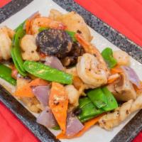 Seafood Combination · Jumbo shrimp, scallop, crabmeat and lobster sautéed mixed vegetables in a delicate Chinese r...