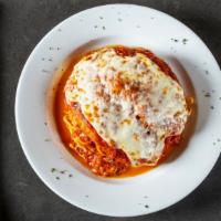 Chicken Parmigiana · Boneless breaded chicken cutlet enveloped with a light tomato sauce and baked with fresh moz...