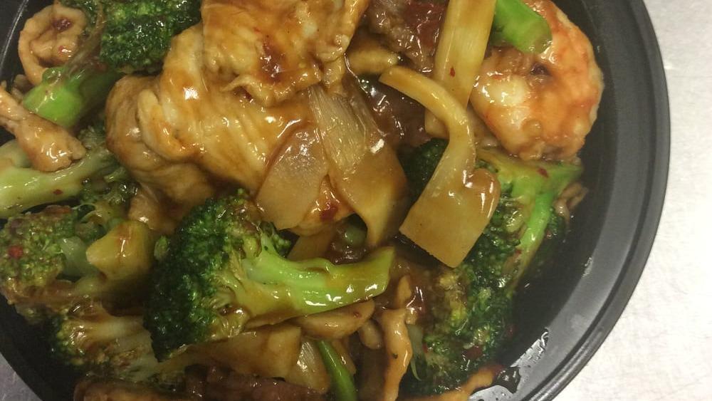 Chicken With Broccoli · Served with choice of rice.