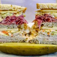 Sloppy Mo! · Double Decker, Double Deli Meat Sandwich Served Cold on Rye Bread. With Coleslaw, Russian Dr...