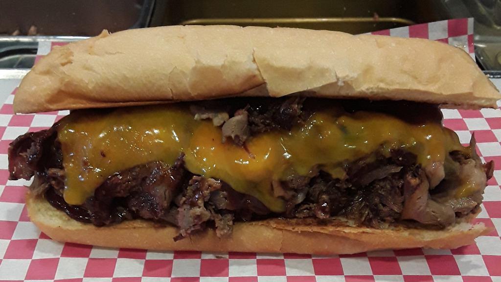 Smoke'N Mo · Smoked Beef Brisket,  BBQ Sauce, Cheddar Cheese on a Hoagie Roll
