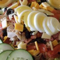 Deli Chef Salad · Diced corned beef, turkey, cheddar and swiss cheese, chopped egg, tomato, cucumber, black ol...
