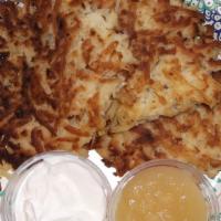 Potato Latkes · Three pancakes with sour cream and apple sauce.