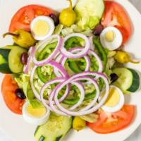 House Salad · The traditional salad, mixed greens with cucumbers, tomatoes and garni.