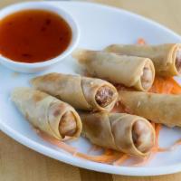Spring Rolls · Crispy fried rice paper rolls filled with vegetables & noodles, served with a sweet & sour s...