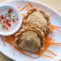 Chicken Empanadas · Pastries with a curry-seasoned filling of minced chicken, peas & carrots, served with a swee...