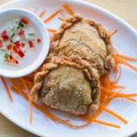 Vegetable Empanadas · Pastries with a curry-seasoned filling of potato, peas, & carrots, served with a sweet dippi...
