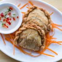 Pumpkin Empanadas · Pastries with a curry-seasoned filling of thai pumpkin, served with a sweet dipping sauce.