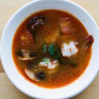 Tom Yum Soup · Spicy chicken broth-based soup with mushrooms, tomatoes & shrimp