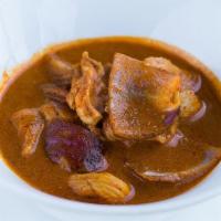 Yellow Curry · A mild curry made with curry spices, coconut milk potatoes & red onions (Vegan with choice o...