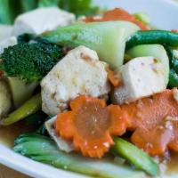 Sauteed Vegetables (V) · A stir-fry of tofu with market vegetables — typically including broccoli, asparagus, carrots...