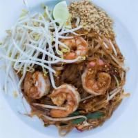Pad Thai · Medium rice noodles stir-fried with egg,. spring onions, bean sprouts & red tofu, garnished ...