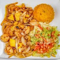 Camarones Hawaianos · Grilled shrimp topped with grilled onions, mushrooms, pineapple chunks and our special pinea...