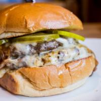 The El Camino Burger · One of four-pound patties of house-ground brisket or chuck, caramelized onion, cooper sharp ...