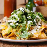 Panchos Nachos · Beans, mixed cheese, pickled jalapeños, tomatoes, crema, and tortilla chips. Add Mac 'n chee...