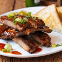 Pork Spare Ribs · St. Louis cut pork ribs, chili-lime rub, honey bbq