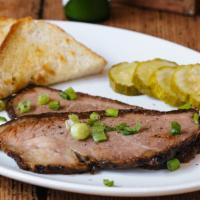 Beef Brisket · Served Texas style with a side of Texas toast and pickles. Cooked in house in our twin 200-p...