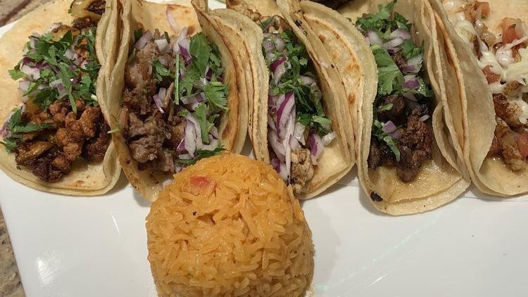 Al Patron Tacos · A mix of all tacos, one carnitas, one pastor, one steak, one chicken taco and one shrimp.