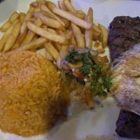 Churrasco · Skirt steak topped with a fried egg, served with mexican rice, french fries a side of pico d...