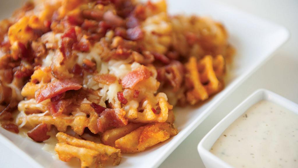 Loaded Waffle Fries · Cheese and bacon served with side of ranch dressing.