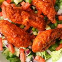 Buffalo Chicken Salad · Hand-breaded, fresh chicken tenders tossed in buffalo sauce (mild, hot or sweet 'n spicy) on...