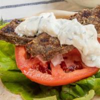 Lamb & Beef Gyro Sandwich
 · Gyro. Lamb and beef on pita bread with onions, lettuce, tomatoes and tzatziki sauce.