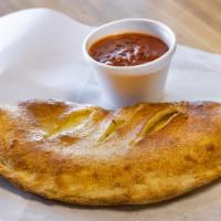 Small Cheese Calzone · Our calzones are loaded with mozzarella cheese (and any other topping of your choice) and se...