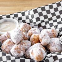 New Fried Dough Poppers · Delicious balls of fried and sugared house made dough. Served with our own sweet icing dip.