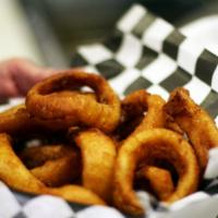 Onion Rings · A generous serving of our thick cut beer battered onion rings.