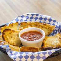 Garlic Bread · Yummy slices of our garlic bread...baked in our brick lined ovens. Served with a side of mar...