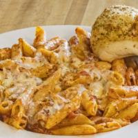Baked Ziti · Ziti baked with mozzarella and Romano cheese and topped with our house-made marinara. Served...