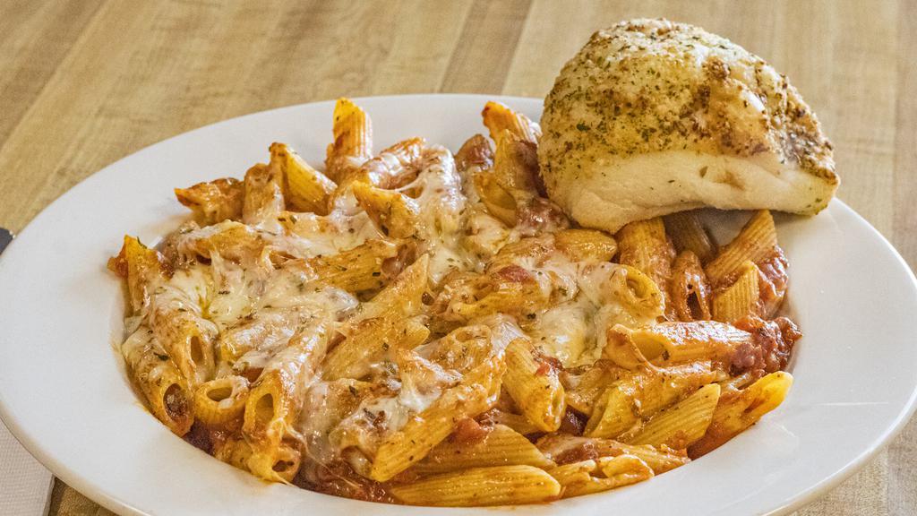 Baked Ziti · Ziti baked with mozzarella and Romano cheese and topped with our house-made marinara. Served with a fresh baked pizza roll.