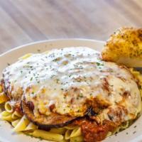 Eggplant Parmigiana · Freshly sliced and hand-breaded eggplant, lightly fried and topped with house-made marinara ...